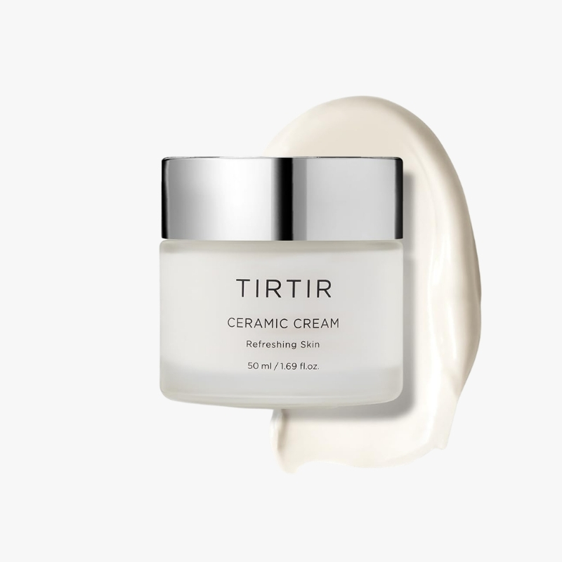 TIRTIR Ceramic Cream jar with metallic lid, label reads ‘CERAMIC CREAM’ and ‘Refreshing Skin’ with a cream smear in the background, 50 ml.