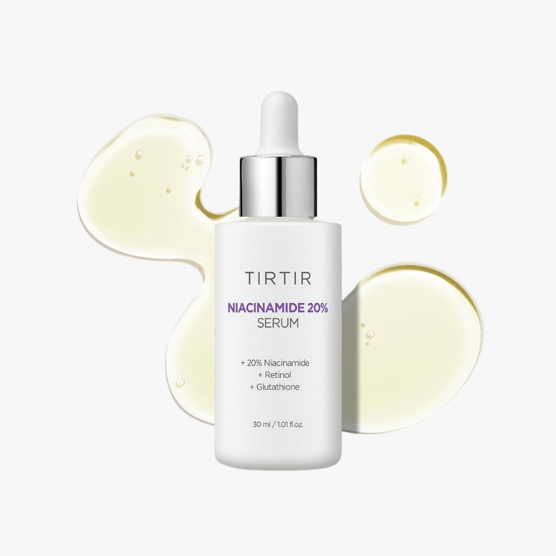 TIRTIR Niacinamide 20% Serum bottle with pale yellow serum droplets behind it on white background.