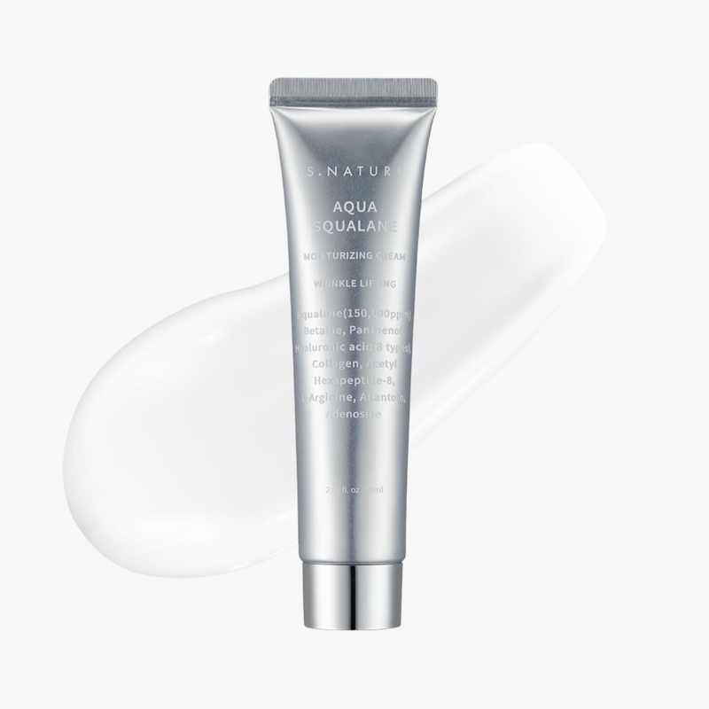 S.NATUR Aqua Squalane moisturizing cream tube with a white cream smear in the background.