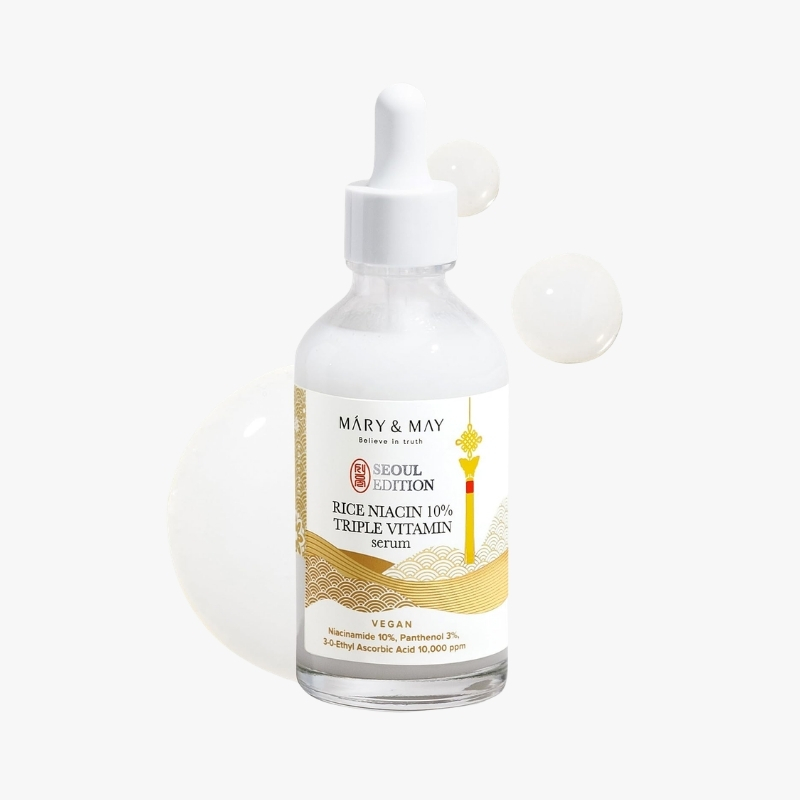 Clear glass dropper bottle labeled Mary & May Rice Niacin 10% Triple Vitamin serum, Seoul Edition (vegan)