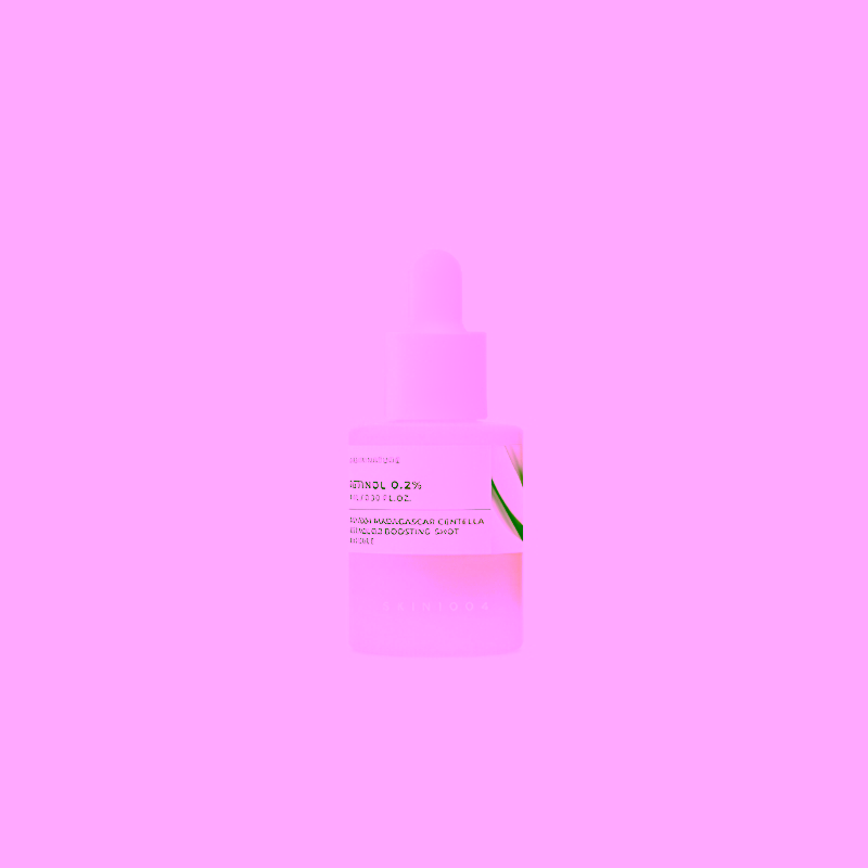 Dropper bottle of skincare serum with beige liquid on a white background, minimal label visible.