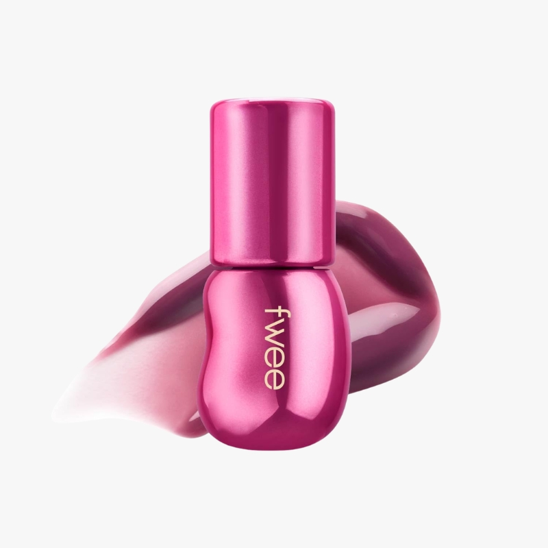 Bright pink nail polish bottle with a glossy hot-pink swatch in the background, set on a white surface.