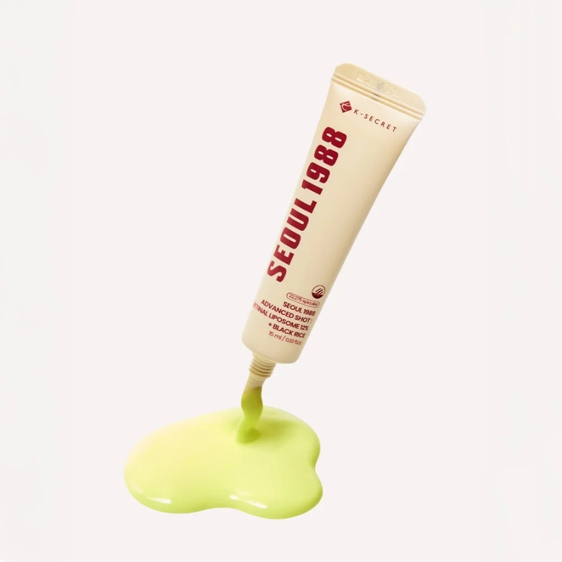 Neon lime green cream leaking from a small tube labeled Seoul 1988 onto a glossy puddle on a white background.