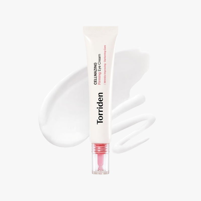 Tube of Torriden CelLIMAZING Firming Eye Cream with pink applicator against a white background and a cream smear behind it, showing the product packaging.