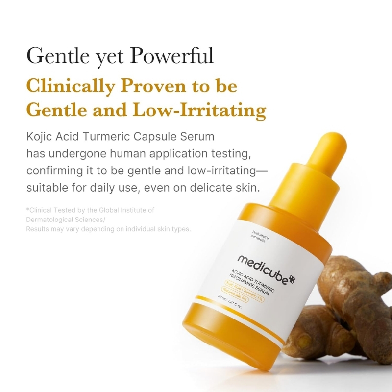 Promotional image of a yellow dropper bottle labeled Meducube Kojic Acid Turmeric Serum leaning against ginger, with gold text claiming it is gentle and low-irritating.