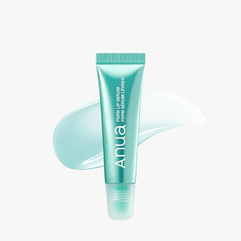 Turquoise tube of Anua lip serum with a pale teal smear in the background, standing upright against a white backdrop, showcasing its cosmetic package.