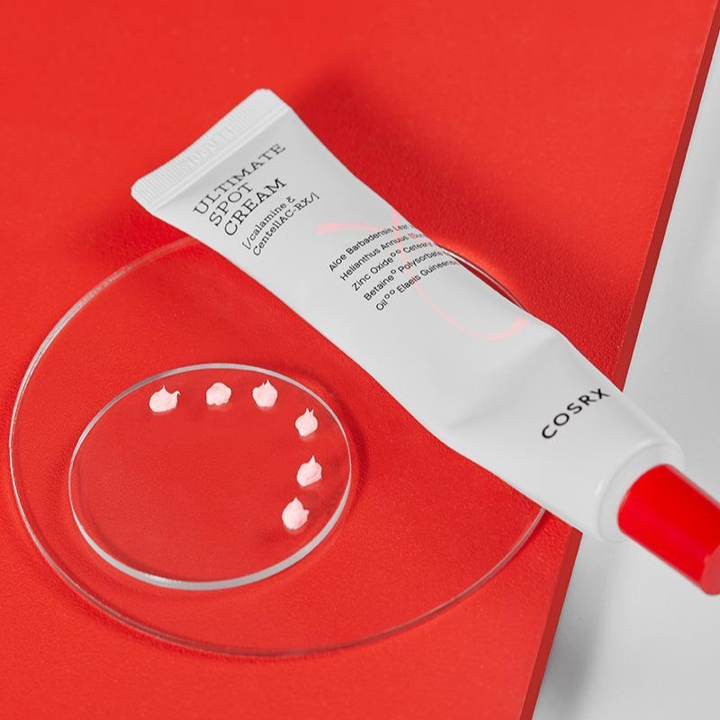 CosRX cream tube on a red background beside a glass dish with white cream dollops.